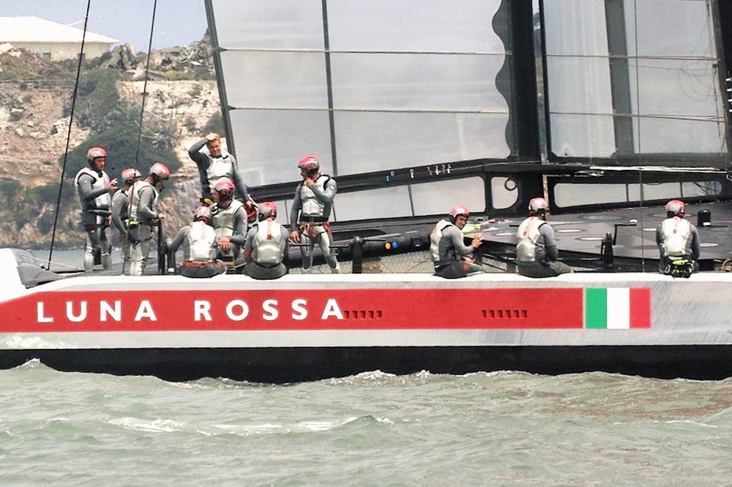 Prada crewman signals that everyone seems to be OK - 2013 America’s Cup © Chuck Lantz http://www.ChuckLantz.com